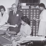 Bill Savitt and women office workers, ca. 1960