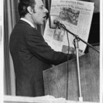 Man holding Hartfor Times newspaper with teachers' strike headline, 1970