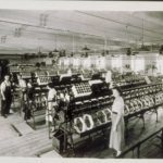 Wauregan and Quinebaug Mills workers with machinery, 1945